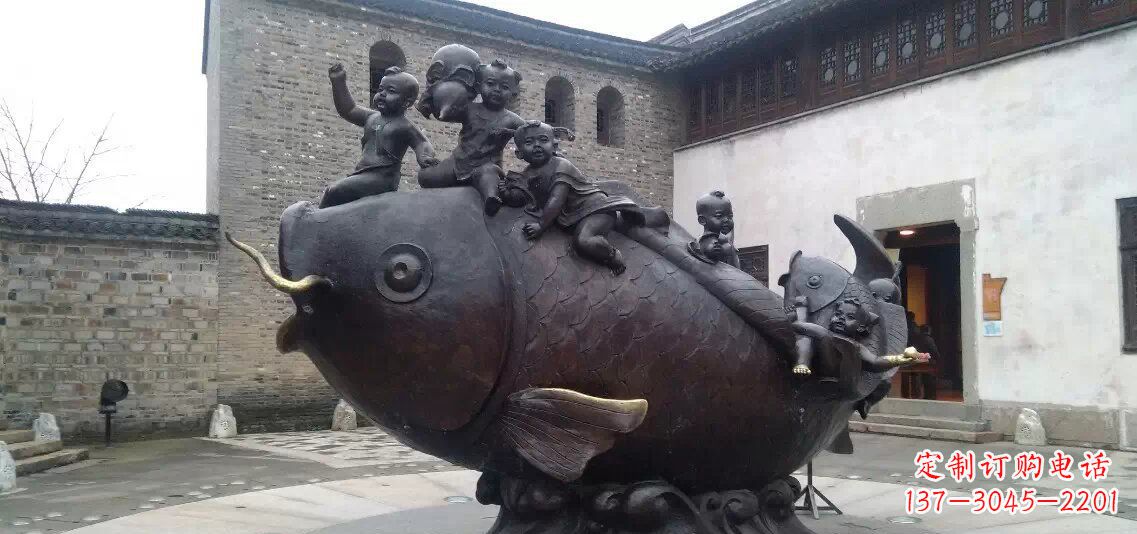 甘肃小孩骑鱼铜雕